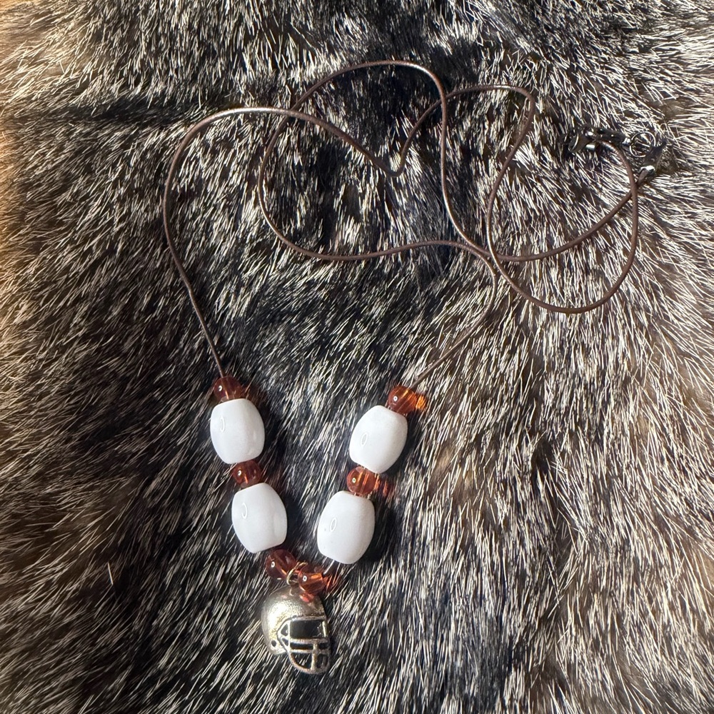 Elegant White and Brown Beaded Necklace with Silver Charm